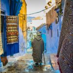 local man walking down street in morocco