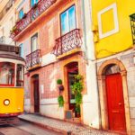 lisbon tram in colourful street