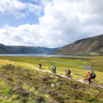 cycling group on trail in scotland