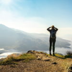 female hiker admires view in scotland