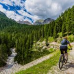 man cycling through italian landscape