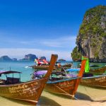 boats on a beach in southern thailand