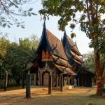 buddhist temple in a forest clearing in thailand