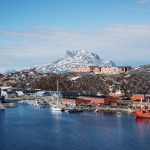 mountain and town in greenland