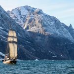 sailing boat and mountains in greeland