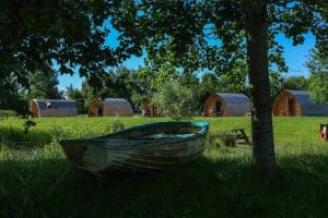 Row boat in a woodland by the raspberry glamping pod