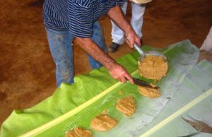 Costa Rica man serving portions of rice