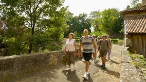 Friends on walk for their last-minute summer getaway