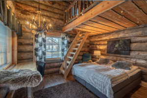 Spacious wood paneled log suite with views of arctic Lapland