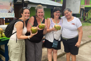 Tourists enjoying a drink with locals Monteverde