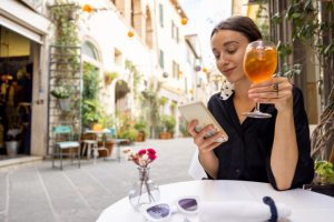 Woman raising a glass in Italy