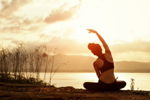 Woman stretching over a lake in France