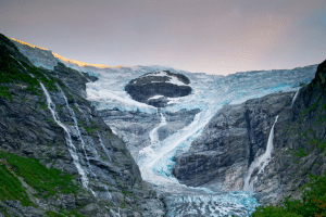 Beautiful Glacier running along mountains in Norway