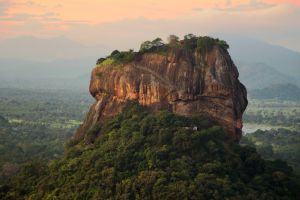 image of Sigiriya rock with a red horizon behind it