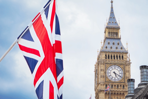 Union jack flag flying beside big ben in London, England