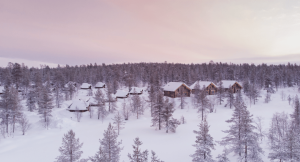 Landscape image of Lapland in March with snow covered forests and wooden cabins