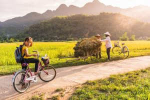 Young Vietnamese girl on her bike near Mai Chau Village