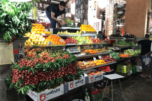 A local food market in Mauritius selling fruit 