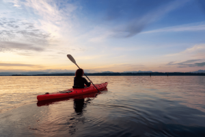 Kayaking at sunset in the Mediterranean sea in Spain 