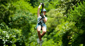 Woman ziplining through the cloud forest in Costa Rica