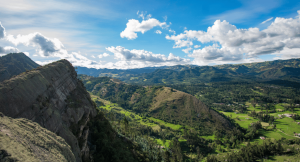 Aerial view of mountains in Colombia with a vast green landscape below