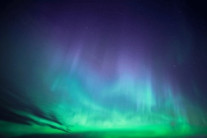 The northern lights in green, blue and purple in Finland