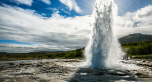 A geyser exploding out of the ground on an arctic holiday in Iceland