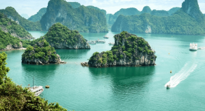 A beautiful lake in Vietnam with boats floating between the small islands 