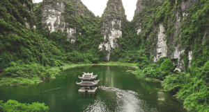 A beautiful sustainable travel destination in Vietnam where people explore a floating temple